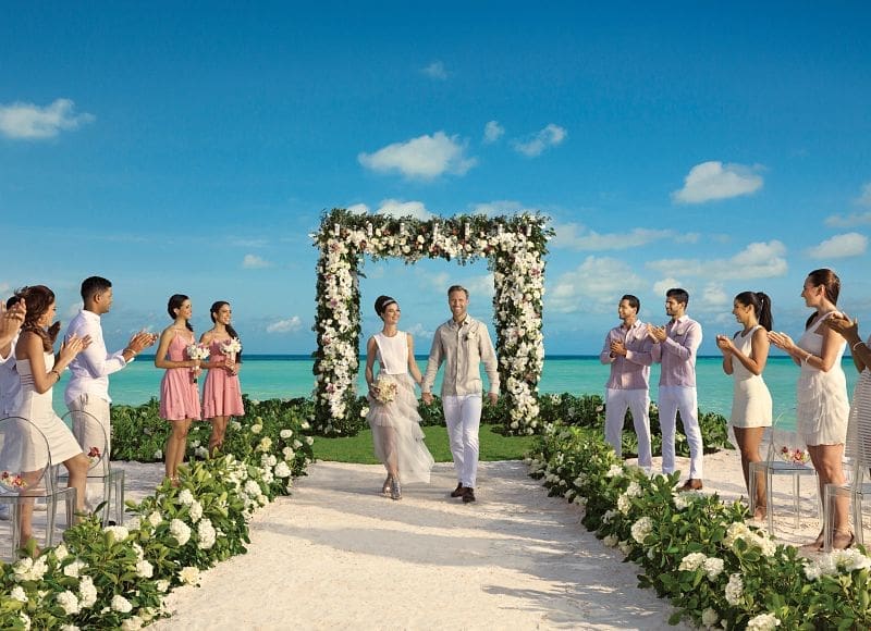 Signature destination wedding setup on beach at Secrets Cap Cana